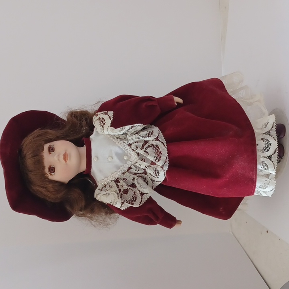 Porcelain Doll with brown Eyes & Curly brown Hair + Christmas Dress